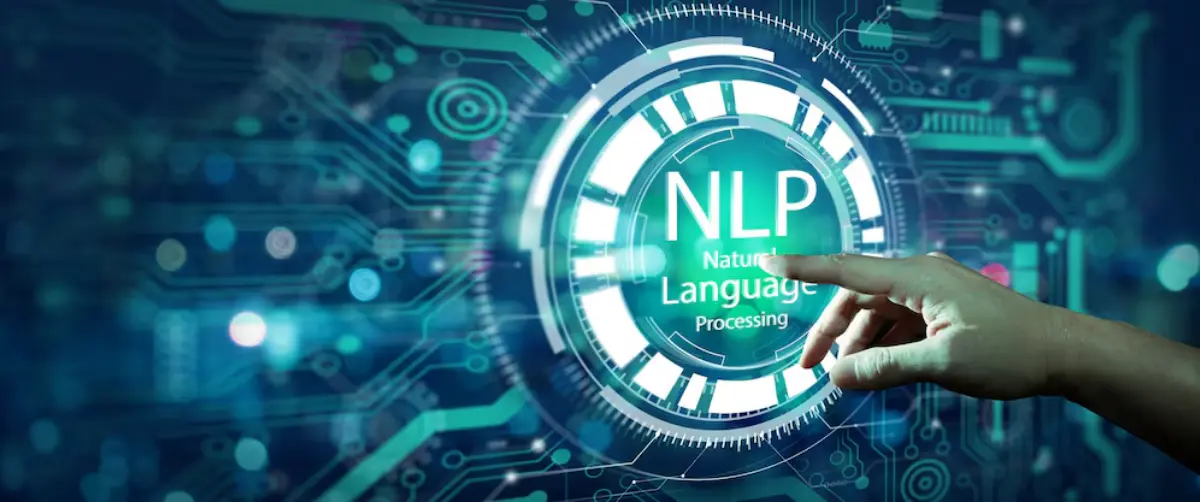 A hand reaches towards a glowing interface displaying NLP and 