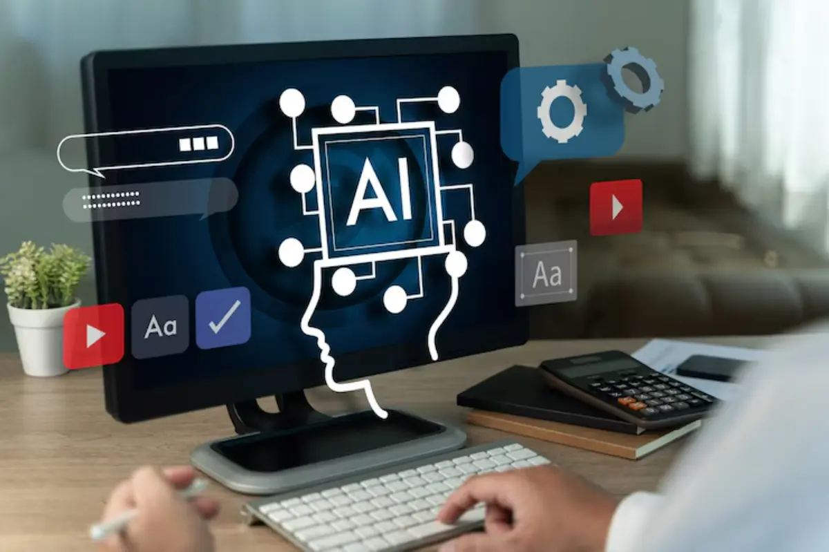 A person interacts with a computer displaying an AI concept surrounded by icons for video, text, and settings on a desk.