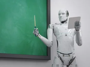 A humanoid robot stands in front of a green chalkboard, holding a pointer in one hand and a tablet in the other.
