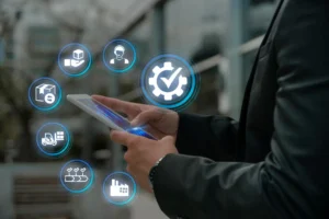 A business professional uses a smartphone with floating icons representing logistics, delivery, support, and quality assurance.